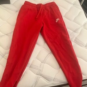 Red Nike joggers